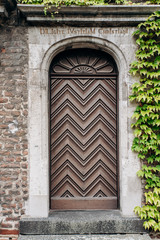 Old wooden door. Old door in a modern building