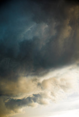 Background of threatening clouds laden with rain. Black thunderstorm clouds. Dramatic sky with clouds