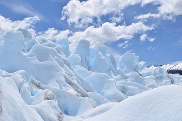 Fototapeta na wymiar light blue glacier with clouds