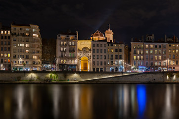 Fototapeta na wymiar River in Lyon at night, blurred water.