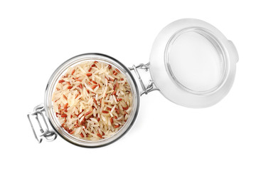 Mix of brown and polished rice in jar isolated on white, top view