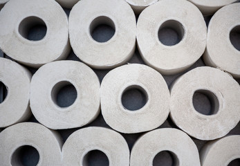 A large white toilet paper roll for use in bathrooms or kitchens, used for cleaning dirt in the bathroom background.