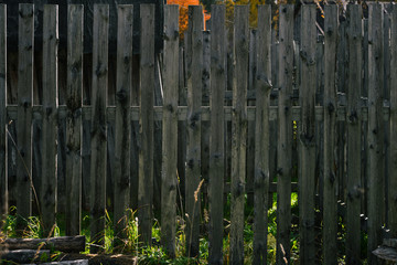Wooden old fence. Countryside and abandoned village plot