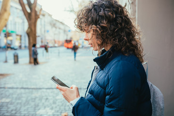 Young woman using her mobile phone