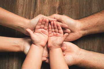 Three hands of family. Love, togetherness, happiness in family concept. - 314924285
