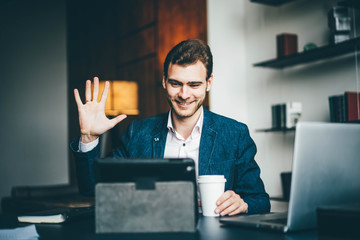Business meeting in office, businessman having video conference at his workspace. Online conference...