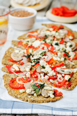 buckwheat Chia seed pizza crust with mushrooms, tomato, Basil and cheese