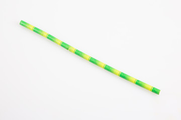 Stripped green yellow Paper cardboard Straw on a White Background