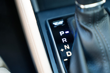 The accelerator handle with automatic transmission gear of car, car interior, close-up.