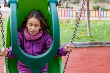 Little girl playing in park