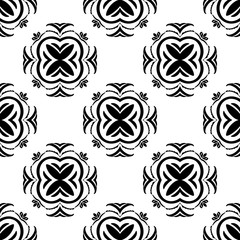 Ethnic vector seamless pattern with tiled motifs in black and white. Hand drawn element pattern with a tribal vibe for fabric, wallpaper, paper, backgrounds and more.