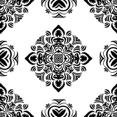 Tribal vector seamless pattern in simple black and white. Hand drawn symmetrical elements with an African Tribal flair. Beautiful for wallpaper, bedding, home decor, textile and printing. All colors