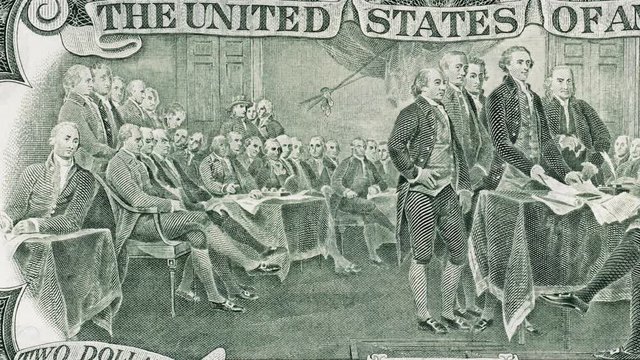 Signing declaration of independence at 4 of July 1776 on US two dollar bill tracking macro. United States dollar close up. Slider shot. 4K