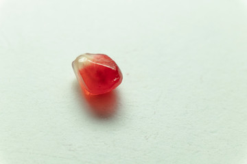 Red pomegranate seeds, white background. Mono Shooting. Juicy bright red fruit. Love.
