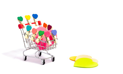 Valentine's day. Small clip heart shape with paper heart shape in supermaket cart. isolated on white