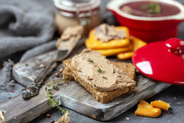 Chicken liver pate on a slice of whole-grain bread.