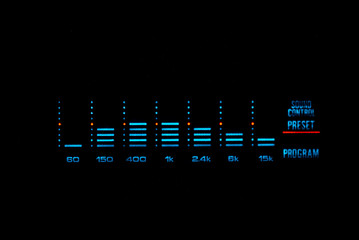 Old stereo graphic volume equalizer glowing in the dark. - obrazy, fototapety, plakaty