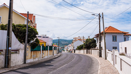 Street view praia das maçãs in Colares, Portugal showing the homes & businesses of the village