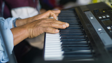 Fototapeta premium The finger that is pressing the piano playing