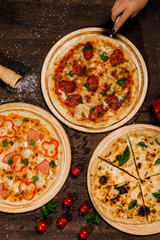 Delicious Italian pizza lies on the table.