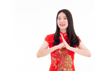 Asian pretty young girl smiling and saying hello with hand gesture by culture Chinese style with...