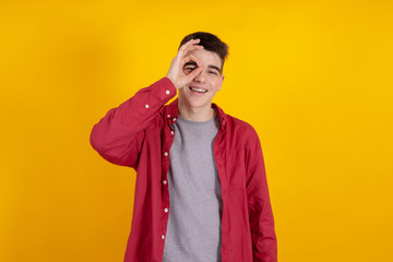 Fototapeta premium young teenage man or student isolated on color background