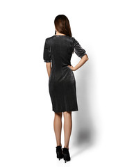 Young beautiful woman posing in new fashion long casual dark shiny silver dress happy smiling walking full body