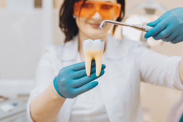 Process of filling on fake tooth