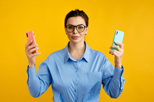 conversion funnel, A B test in marketing and online advertising. Brunette woman holding colored letters A and B in hands with face expression.