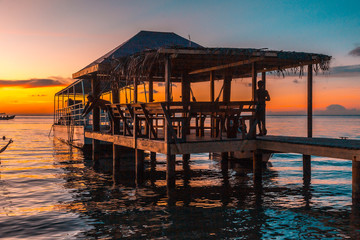 A pier on a beach on the island of Roatan. Honduras