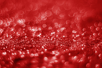 Glitter light abstract red bokeh christmas blurred background