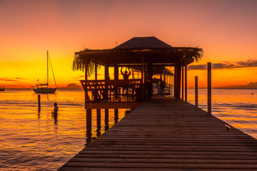 Fototapeta na wymiar Beautiful sunset on a beach on Roatan Island. Honduras
