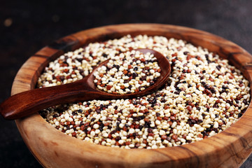 Set of quinoa Red, white and brown quinoa in a wooden spoon. healthy food