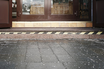 salt against slippery sprinkled at the entrance to the building