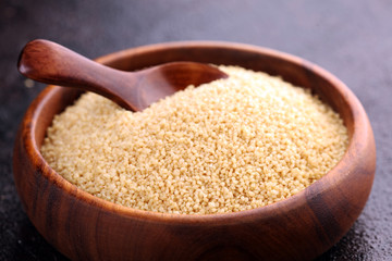Couscous in a wooden spoon. healthy food