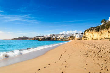 Sandy beach in Albufeira resort village in Algarve, Portugal.