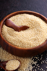 Couscous in a wooden spoon. healthy food