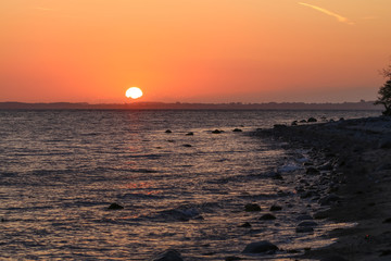 scenic coastline with red sky