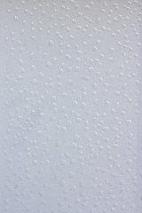 texture of white ceramic tiles with small drops