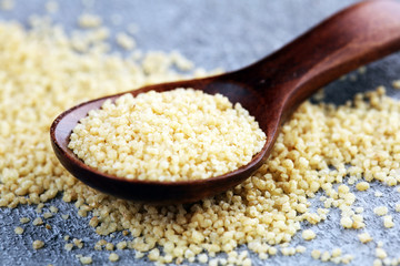 Couscous in a wooden spoon. healthy food