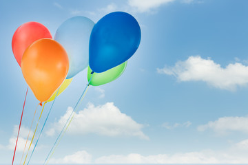 Colorful balloons for birthday and celebrations isolated at blue sky