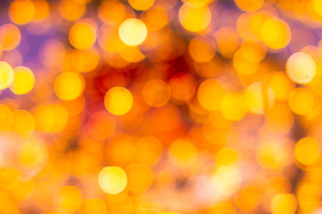 Gold yellow and red abstract background with bokeh defocused blurred lights