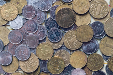 Metal coins of Ukrainian currency, hryvnia, background texture