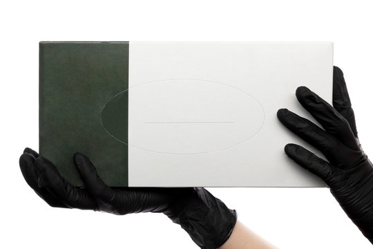 hands in latex medical gloves holding a box of mockup