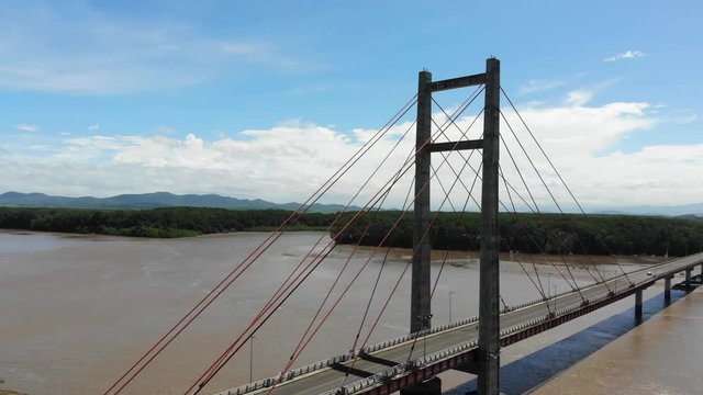 Aerial shot of the Puente de La Amistad de Taiw&aacute;n (Taiwan friendship bridge). Flying backwards at west side of bridge, with Palo Verde NP in background. Guanacaste, Costa Rica.