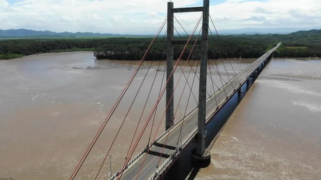 Aerial shot of the Puente de La Amistad de Taiw&aacute;n (Taiwan friendship bridge). Overview shot of bridge, flying backwards. Guanacaste, Costa Rica.