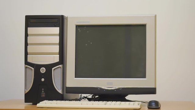 Old desktop computer. Retro vintage personal computer PC with keyboard and monitor. Rotation