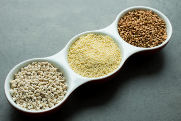 Buckwheat, pearl barley and millet on the table