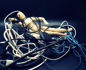 Jumbled mess of cords, wires, headphones