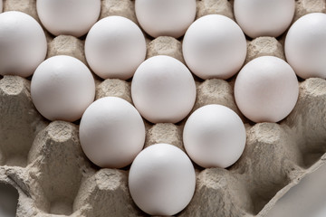 Carton of fresh white eggs